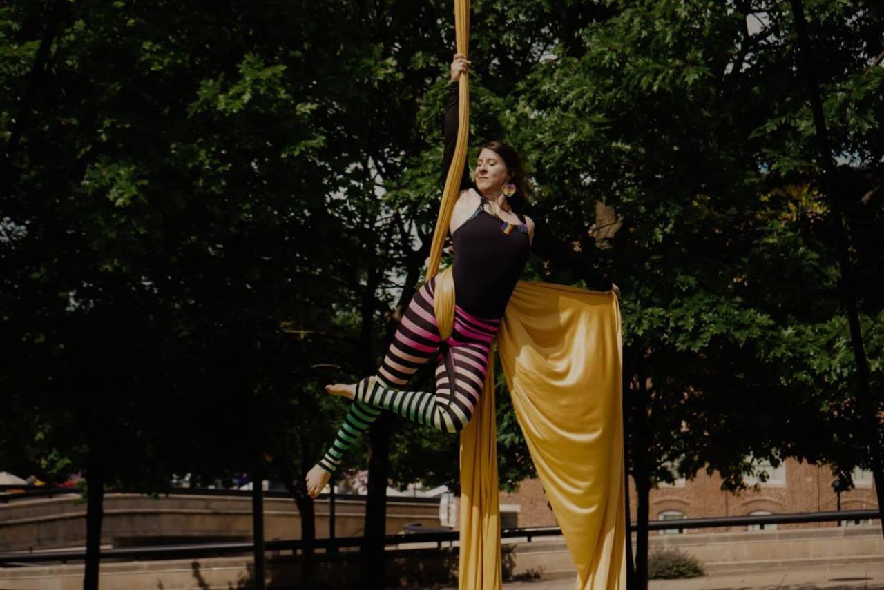 Motif founder Stephanie Poppe performing on aerial silks outdoors